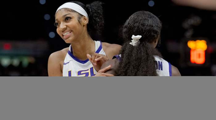 LSU Tigers forward Angel Reese and guard Flua, jae Johnson celebrate against the Virginia Tech Hokies.